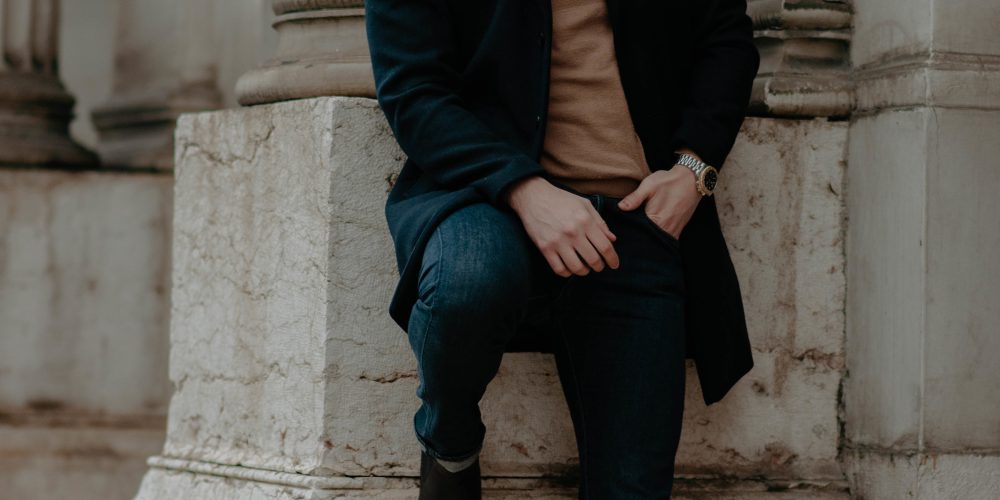 Shallow focus shot of a handsome stylish Caucasian male posing for the camera